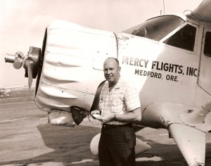 Man near nose of Mercy Flights airplane